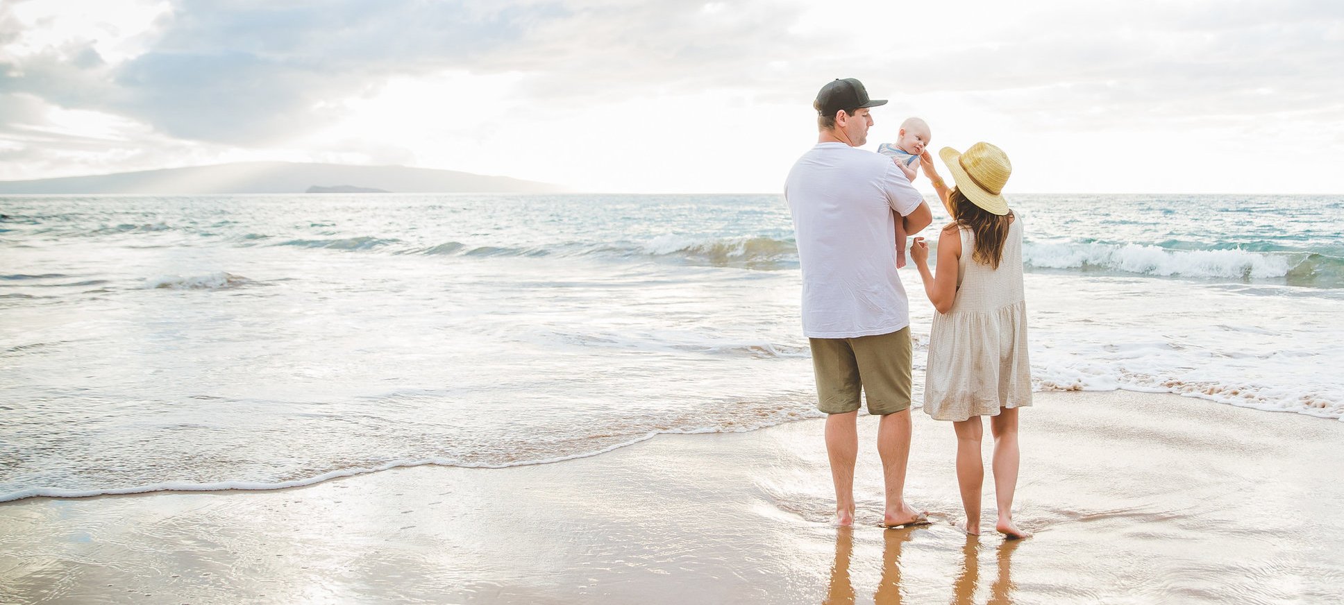 Jillian Harris, her husband and infant son at the beach together on a family photo shoot in Maui